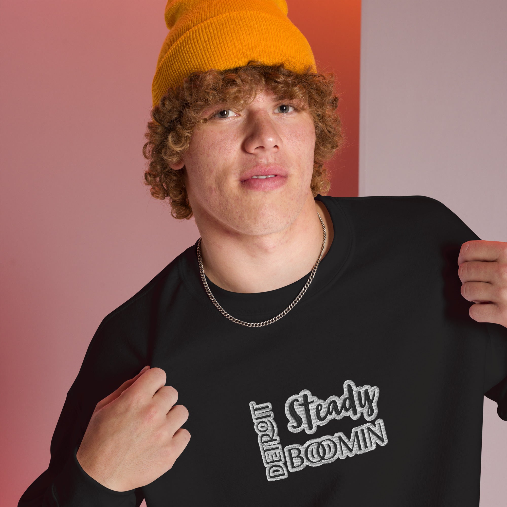 "Close-up detail of Detroit Steady Boomin embroidered logo on premium sweatshirt"