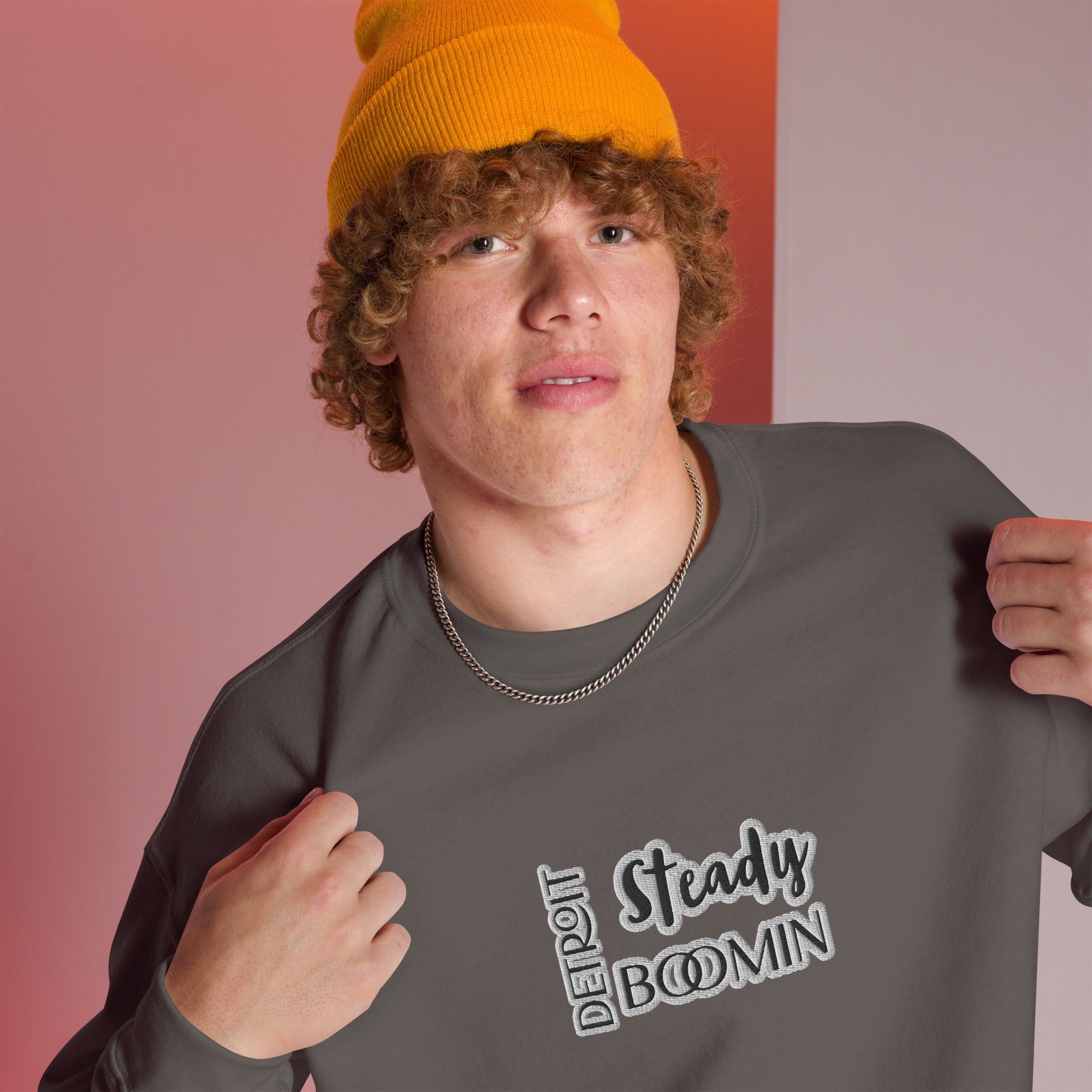 "Close-up detail of Detroit Steady Boomin embroidered logo on premium sweatshirt"
