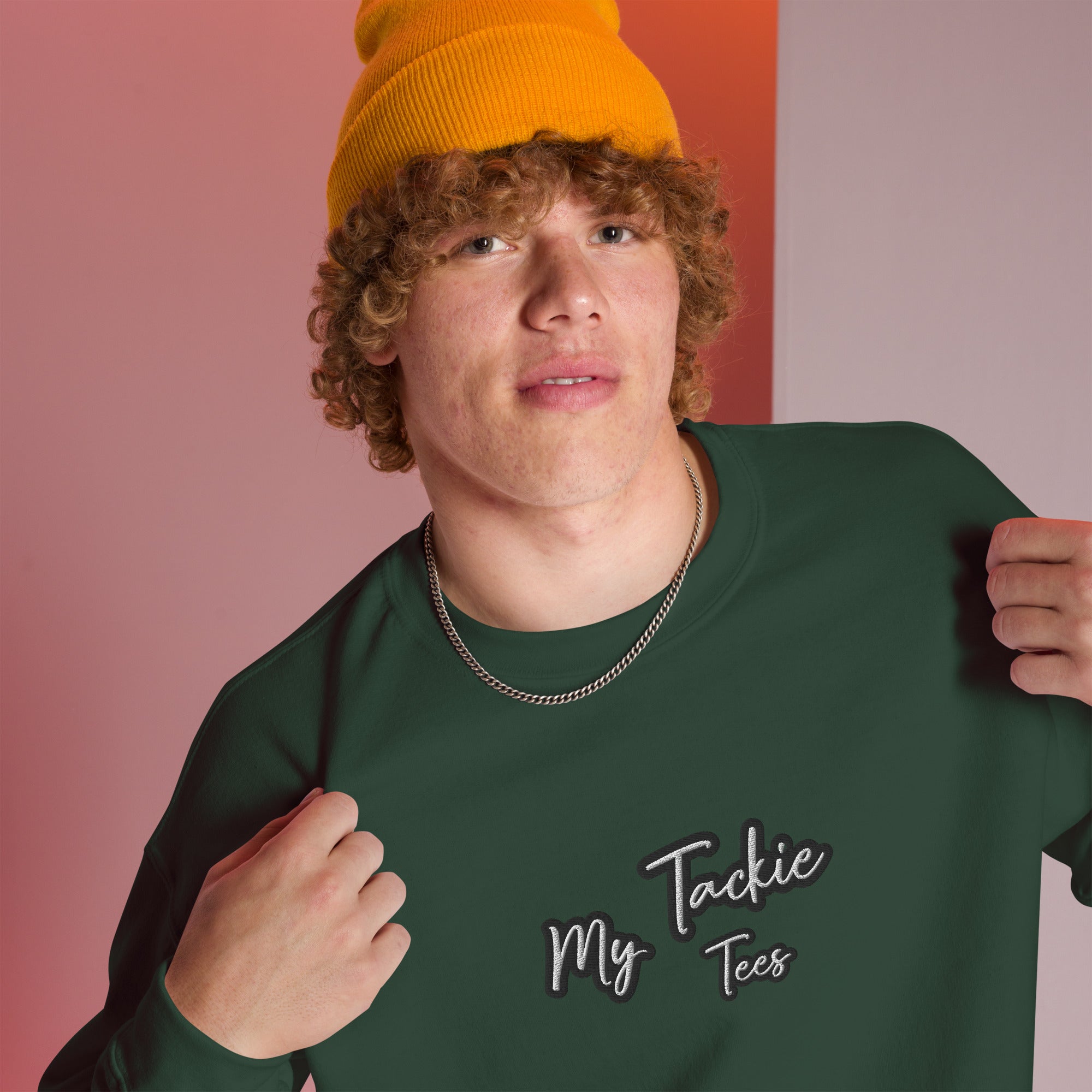 Close-up of My Tackie Tees embroidered logo on men's sweatshirt chest