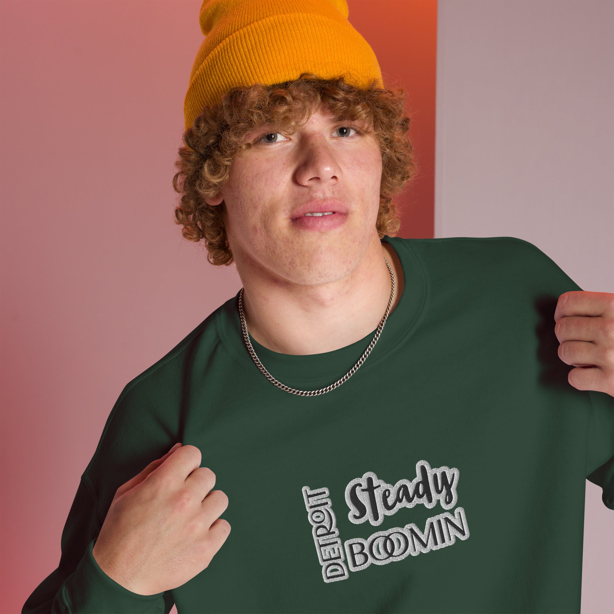 "Close-up detail of Detroit Steady Boomin embroidered logo on premium sweatshirt"