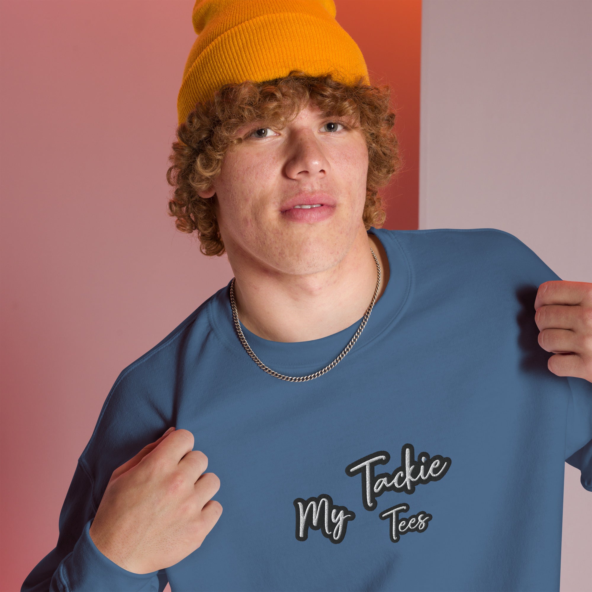Close-up of My Tackie Tees embroidered logo on men's sweatshirt chest