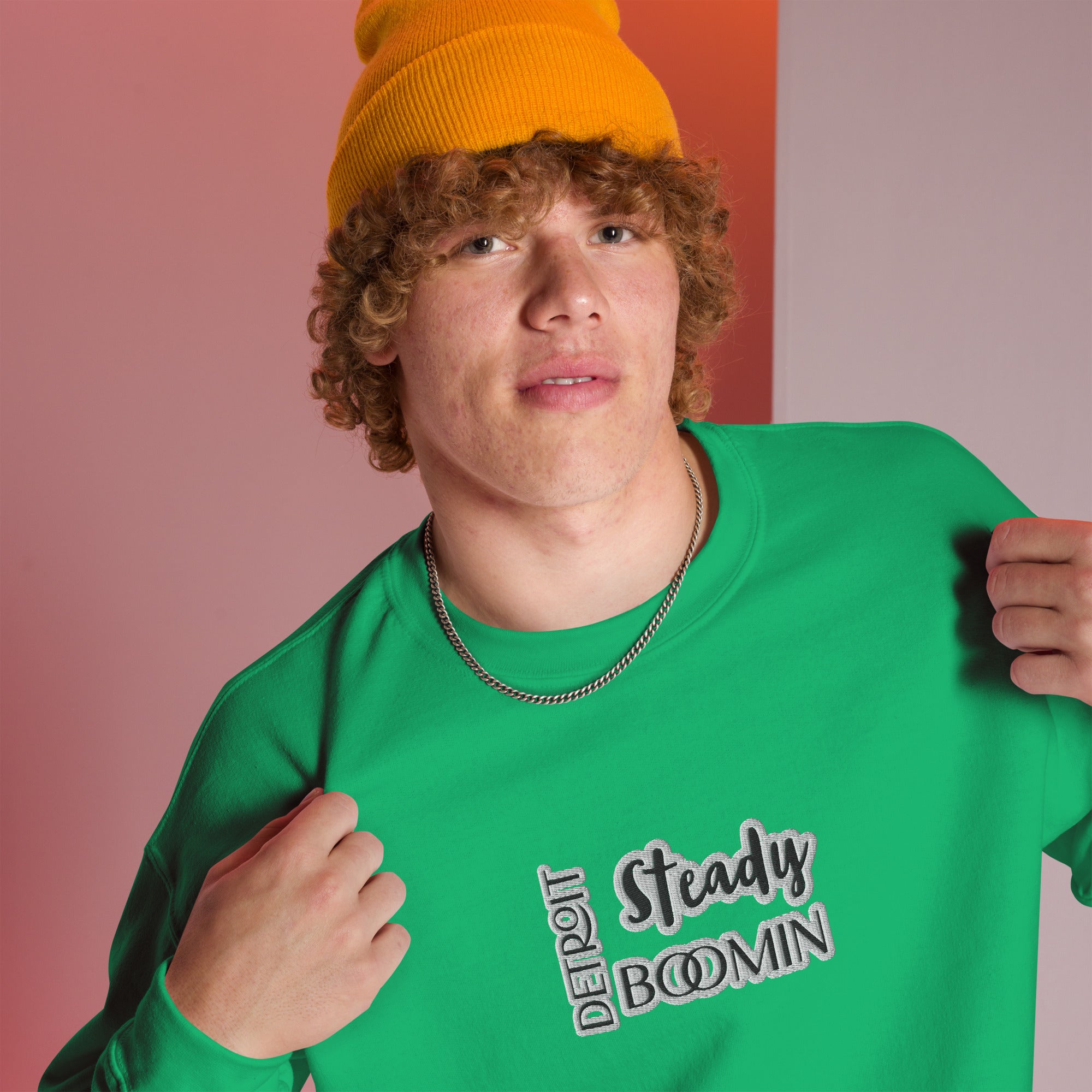 "Close-up detail of Detroit Steady Boomin embroidered logo on premium sweatshirt"