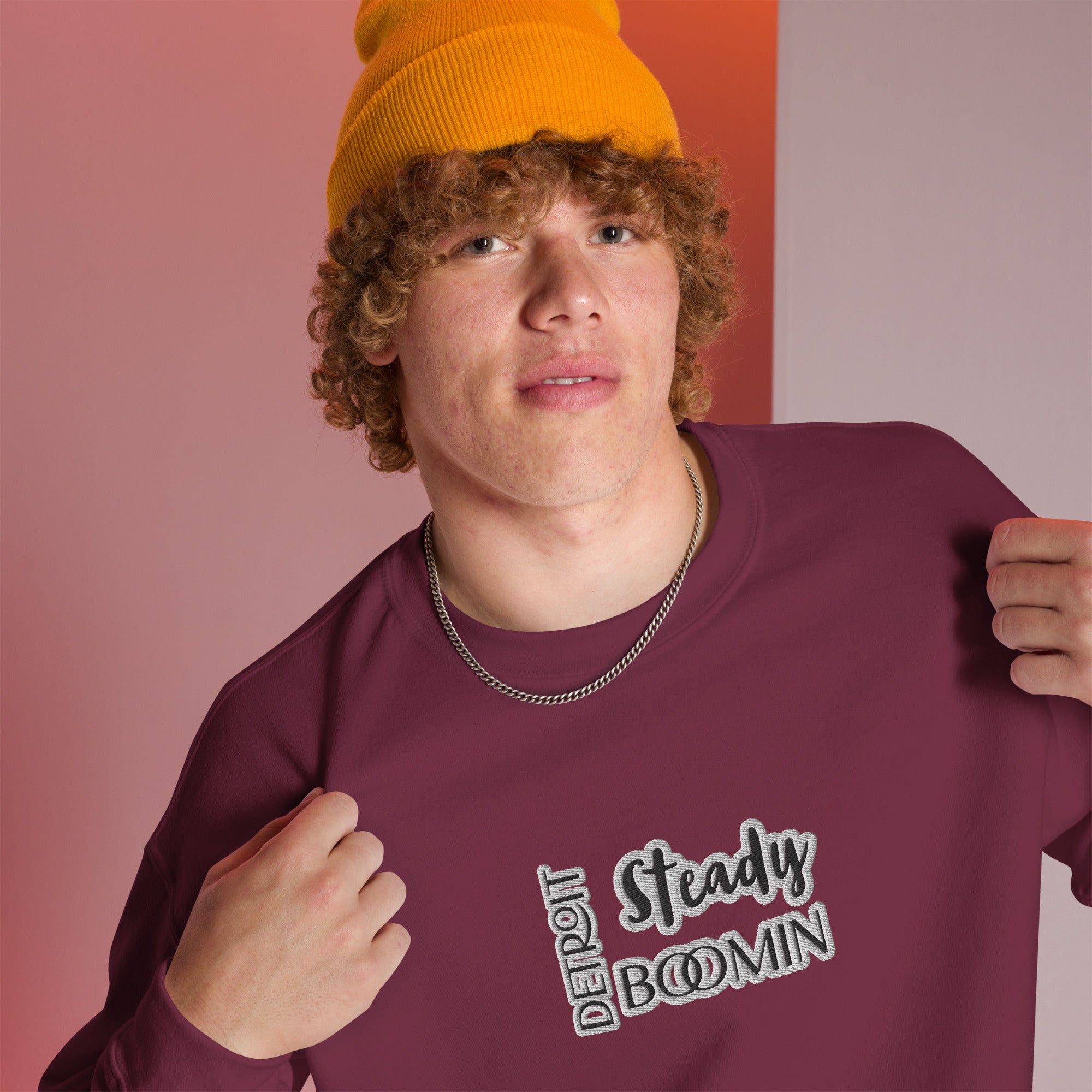 "Close-up detail of Detroit Steady Boomin embroidered logo on premium sweatshirt"
