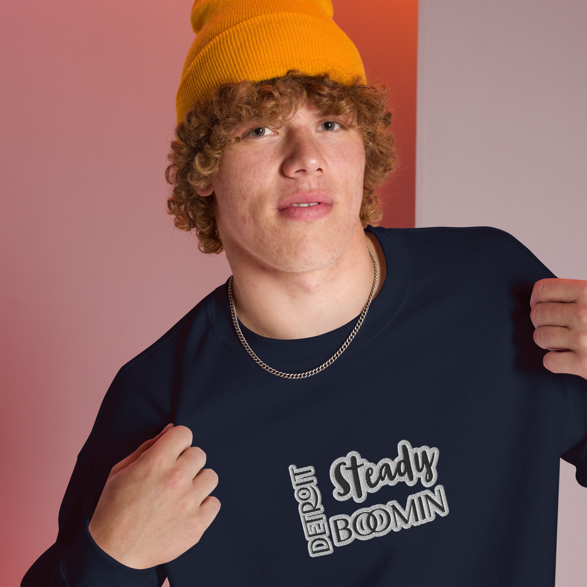 "Close-up detail of Detroit Steady Boomin embroidered logo on premium sweatshirt"