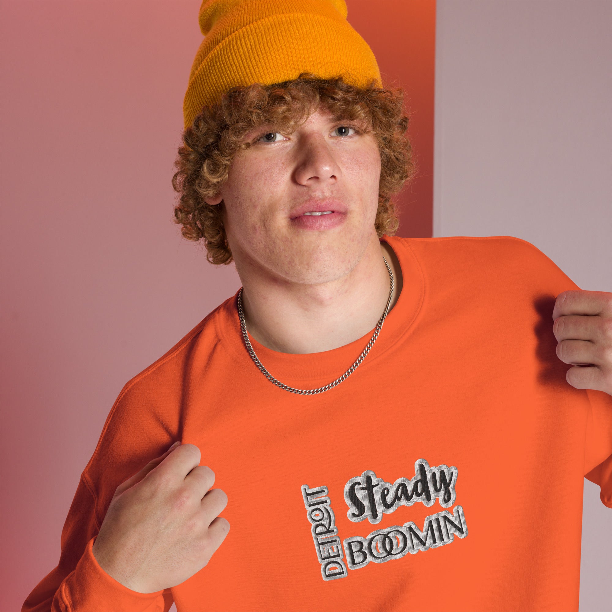 "Close-up detail of Detroit Steady Boomin embroidered logo on premium sweatshirt"