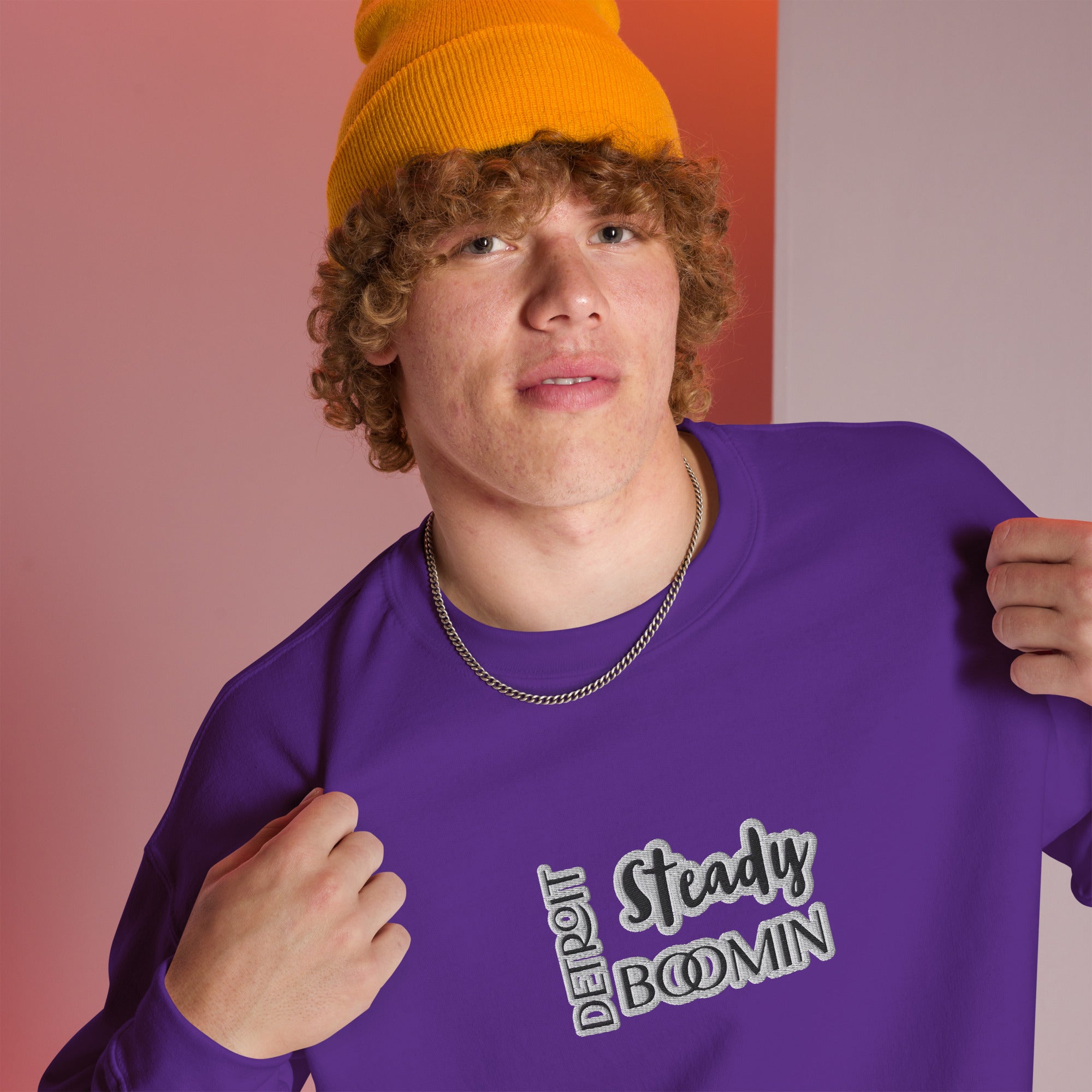 "Close-up detail of Detroit Steady Boomin embroidered logo on premium sweatshirt"