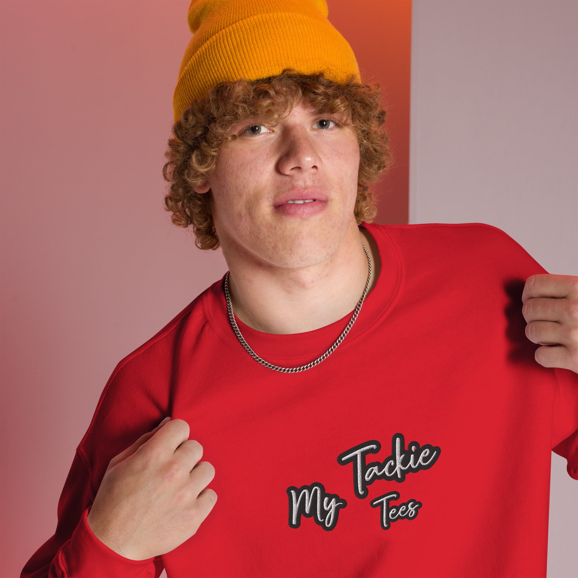 Close-up of My Tackie Tees embroidered logo on men's sweatshirt chest