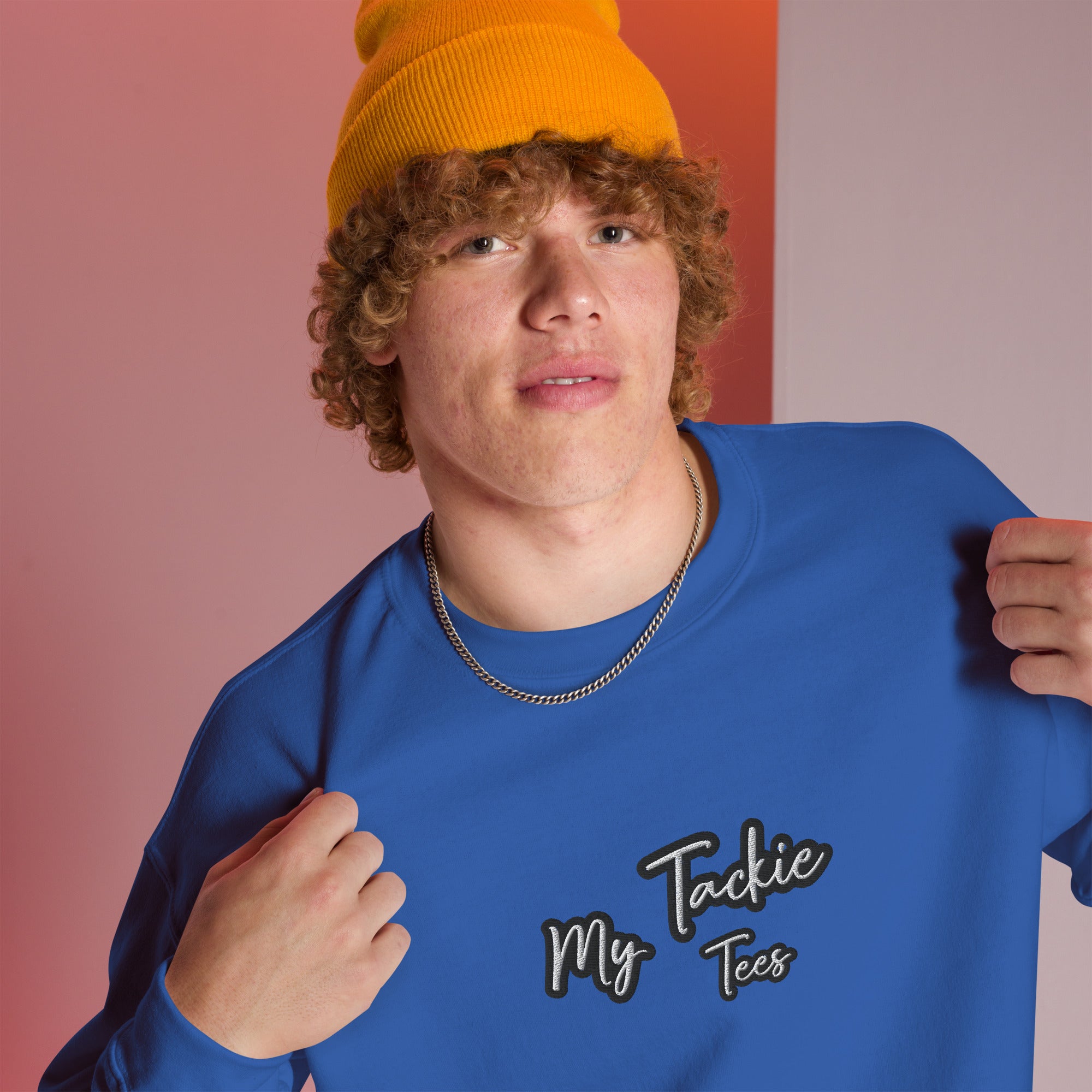 Close-up of My Tackie Tees embroidered logo on men's sweatshirt chest
