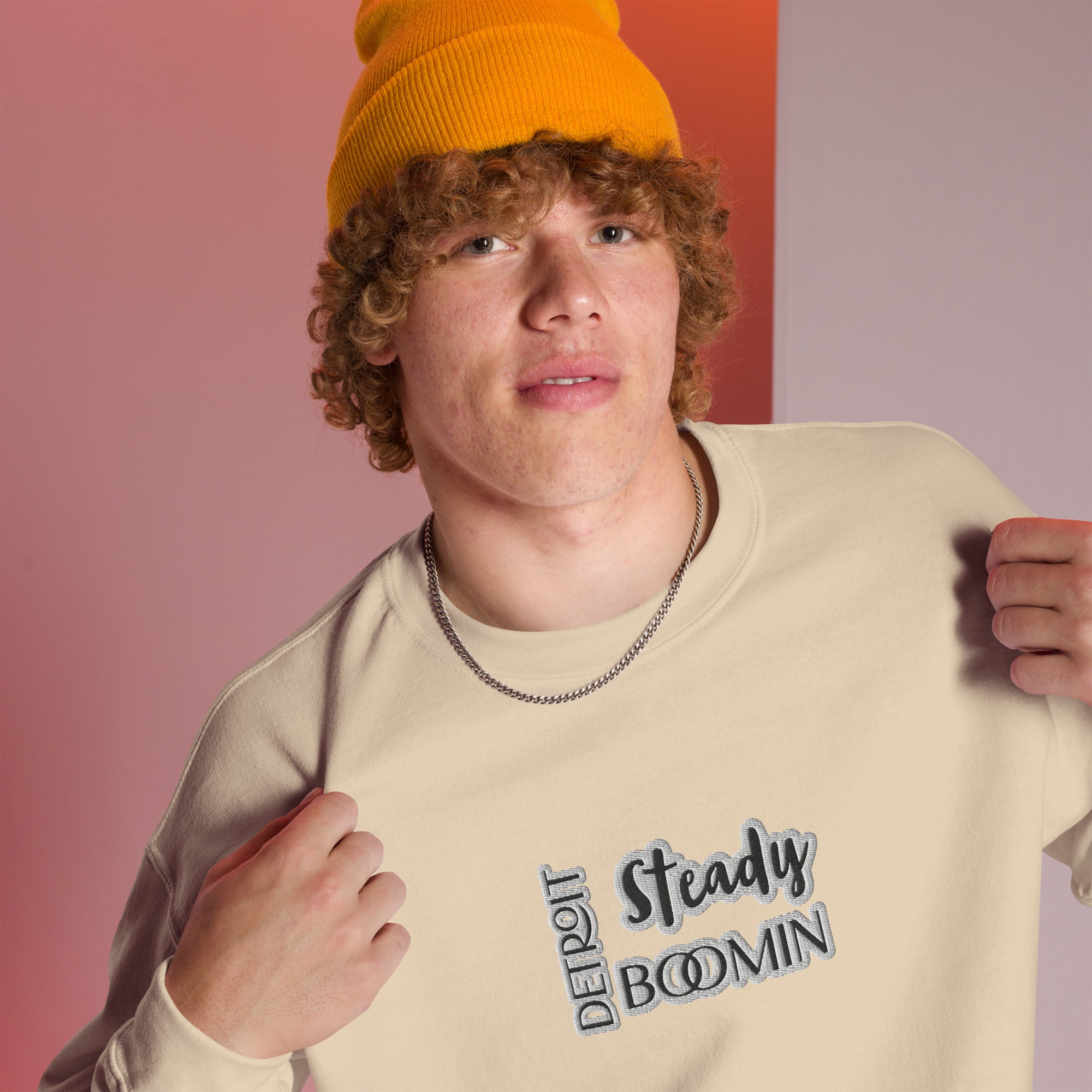 "Close-up detail of Detroit Steady Boomin embroidered logo on premium sweatshirt"