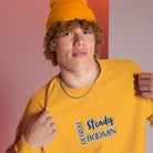 "Close-up detail of Detroit Steady Boomin embroidered logo on premium sweatshirt"
