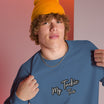 Close-up of My Tackie Tees embroidered logo on men's sweatshirt chest
