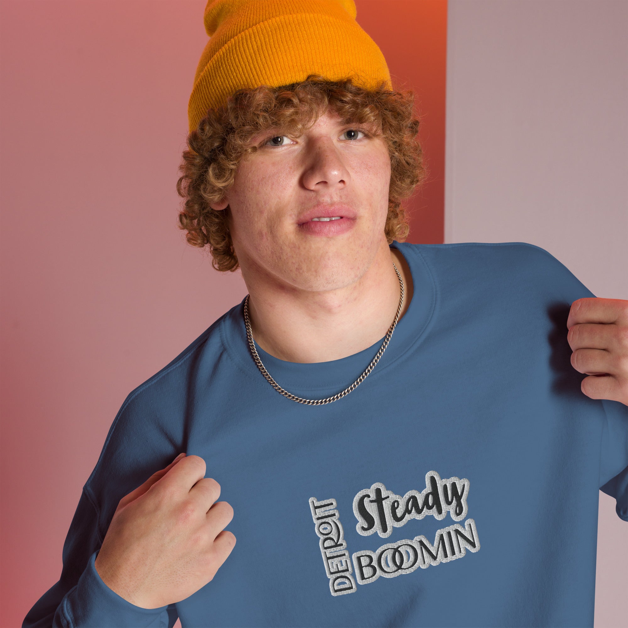 "Close-up detail of Detroit Steady Boomin embroidered logo on premium sweatshirt"
