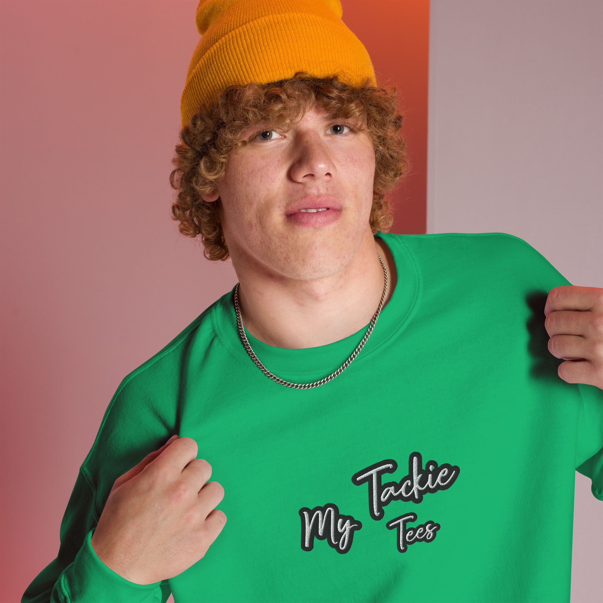 Close-up of My Tackie Tees embroidered logo on men's sweatshirt chest
