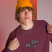 Close-up of My Tackie Tees embroidered logo on men's sweatshirt chest
