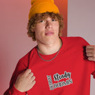 "Close-up detail of Detroit Steady Boomin embroidered logo on premium sweatshirt"
