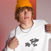 Close-up of My Tackie Tees embroidered logo on men's sweatshirt chest
